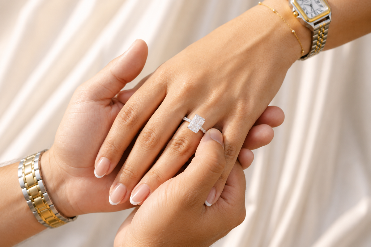 Couple exchanging an engagement ring during a proposal