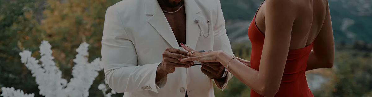 Couple exchanging an engagement ring during a proposal
