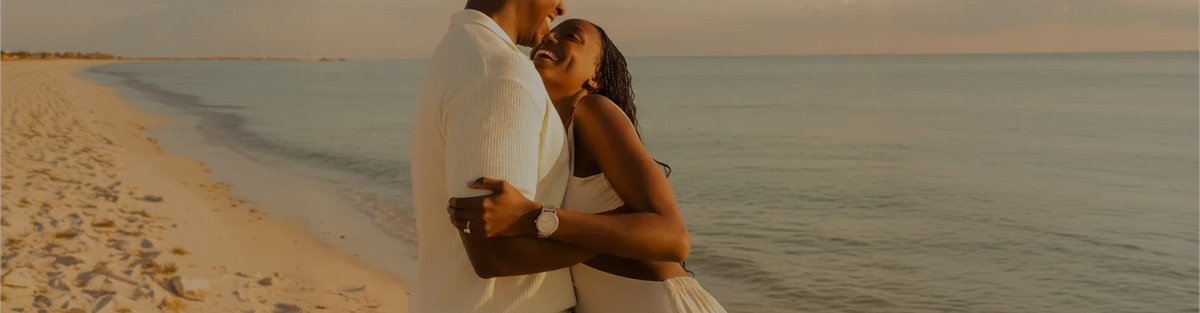 Couple exchanging an engagement ring during a proposal
