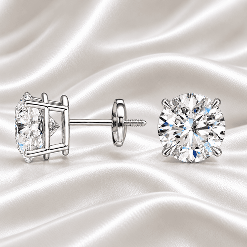 Classic 2 carat total weight round diamond stud earrings in a white gold setting