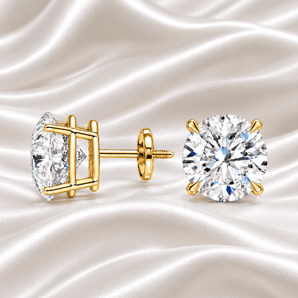 Classic 2 carat total weight round diamond stud earrings in yellow gold by Gabriel Edward Jewelers