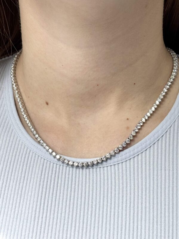 14kt white gold diamond tennis necklace with 3 mm diamonds on lady’s neck