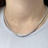 14kt white gold diamond tennis necklace with 3 mm diamonds on lady’s neck