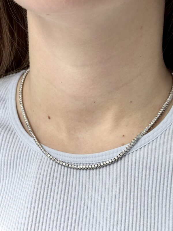14kt white gold diamond tennis necklace with 2.25 mm diamonds on lady’s neck