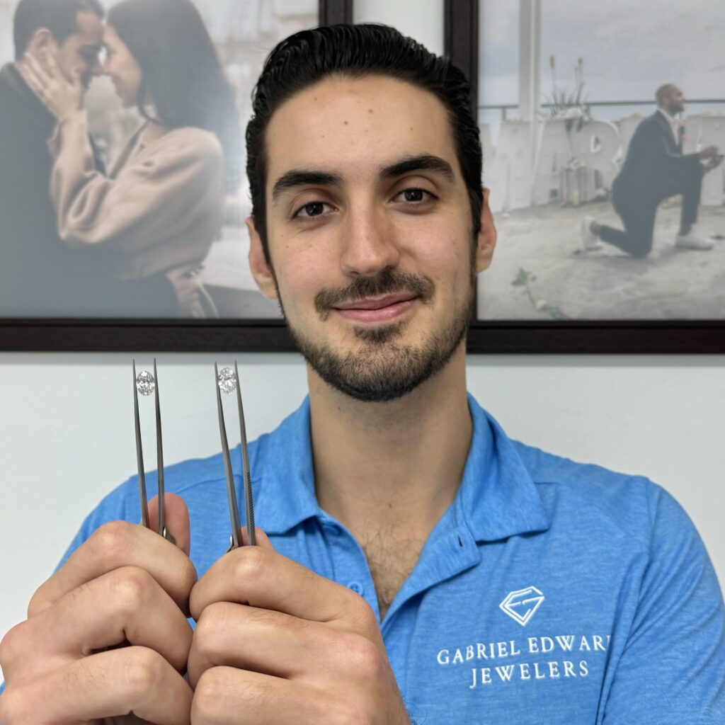 Javi showing an F Color and a D Color Oval-shape Diamond