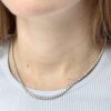 14kt white gold diamond tennis necklace on lady’s neck
