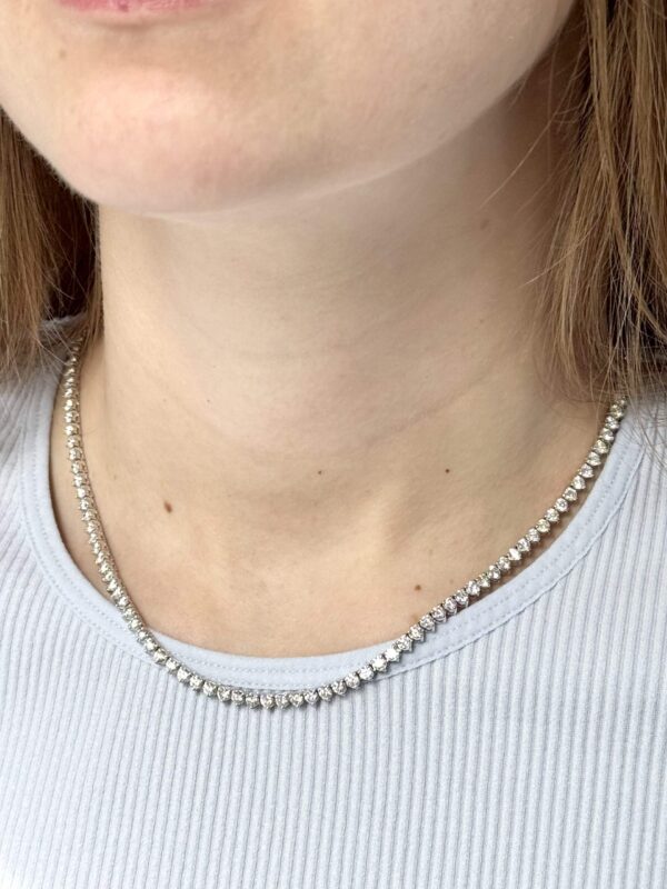14kt white gold diamond tennis necklace on lady’s neck