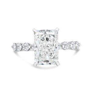 Round diamond accented engagement ring with radiant-cut center diamond